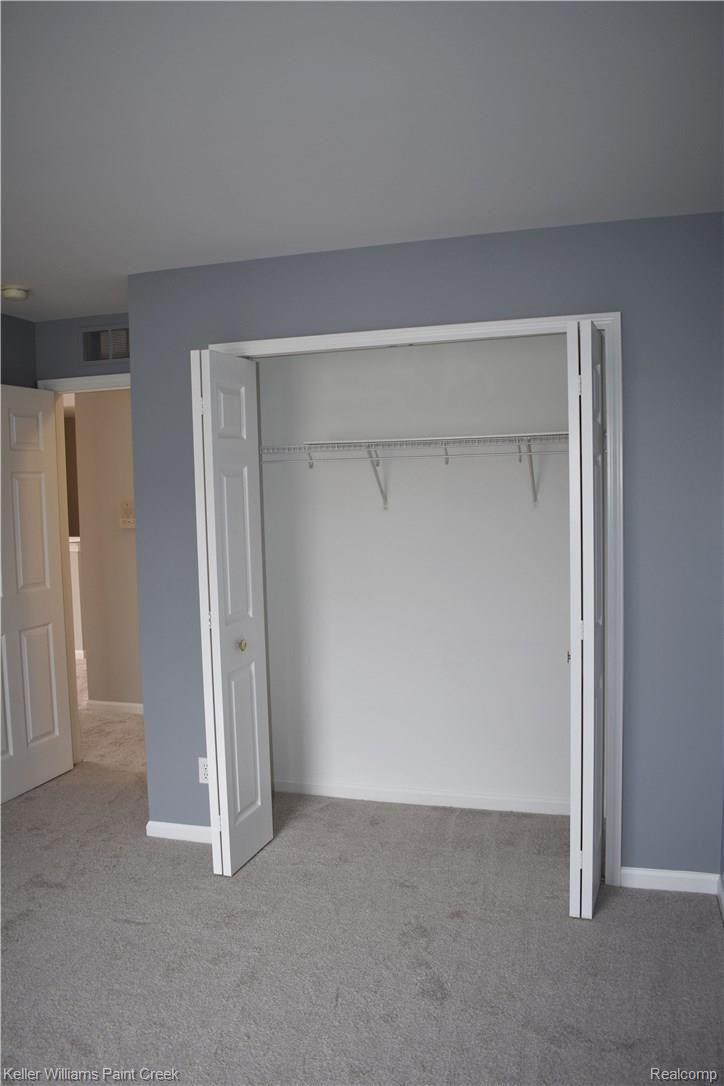 1885 Flagstone Circle Rochester, MI 48307 - Photo 30 of 32 THE LARGE 2ND BEDROOM (11 X 12) ALSO CONTAINS A LARGE CLOSET. NOTE: ALL OF THE CARPET THROUGHOUT THE CONDO WAS REPLACED IN APRIL 2018