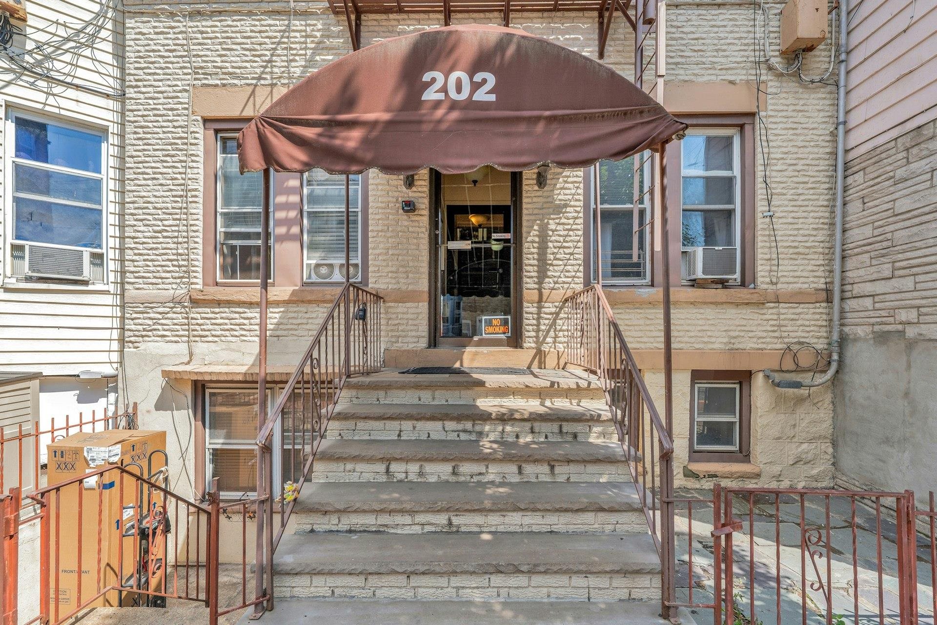 a front view of a house with glass windows