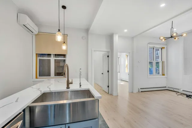 a kitchen with a sink stove and refrigerator