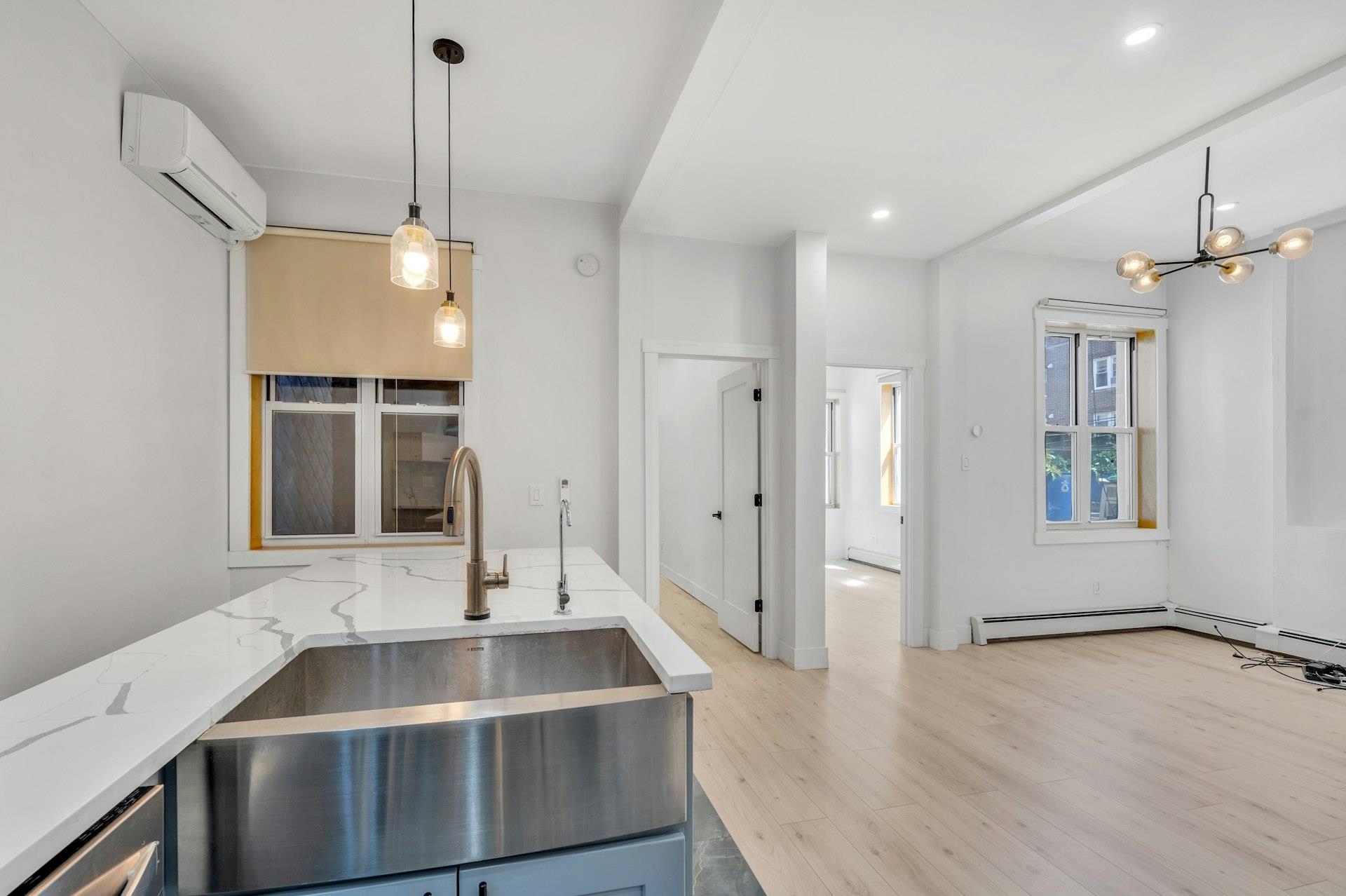 202 48th Street, Unit 3 Union City, NJ 07087 - Photo 12 of 17 a kitchen with a sink stove and refrigerator