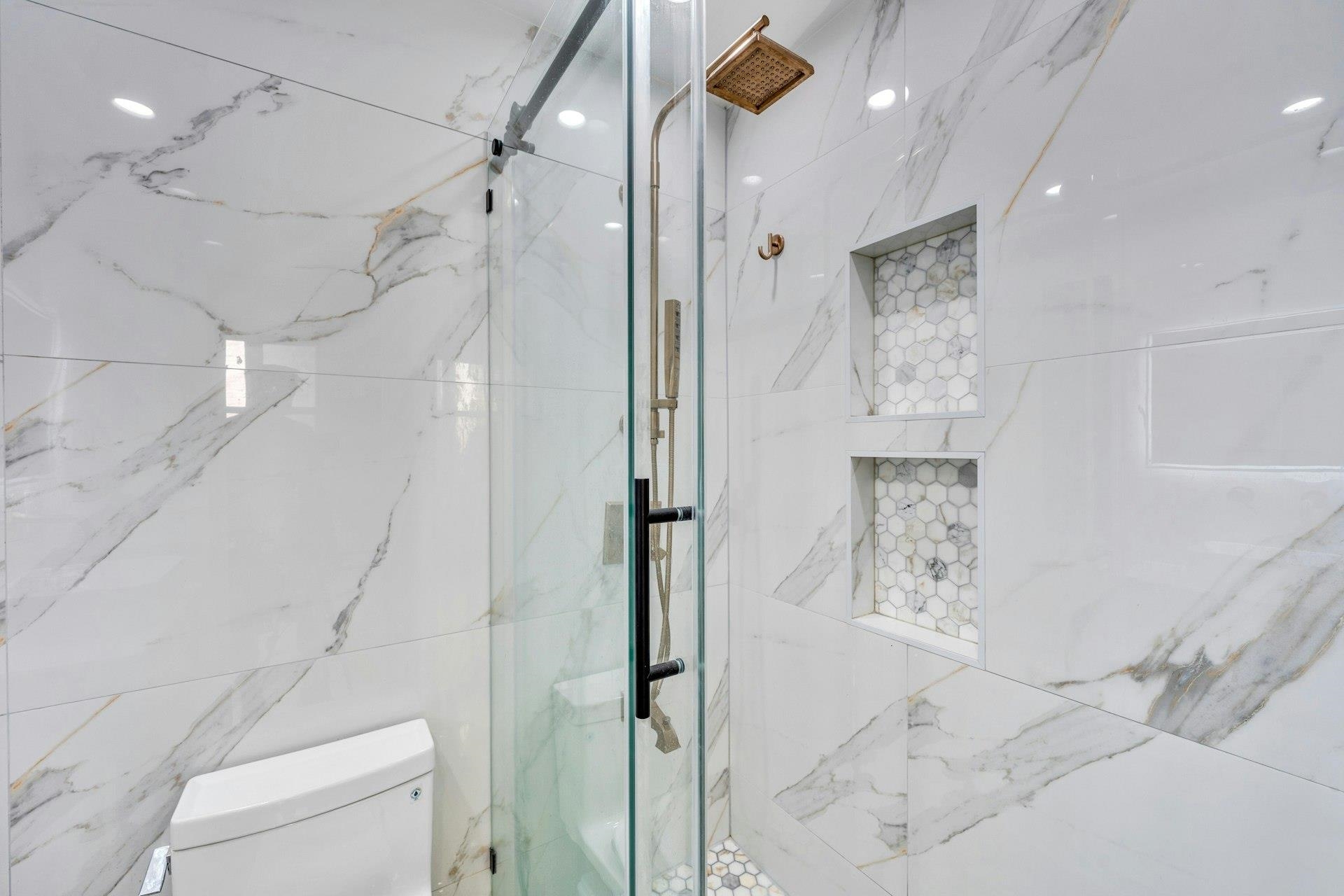 202 48th Street, Unit 3 Union City, NJ 07087 - Photo 14 of 17 a bathroom with a shower and a toilet