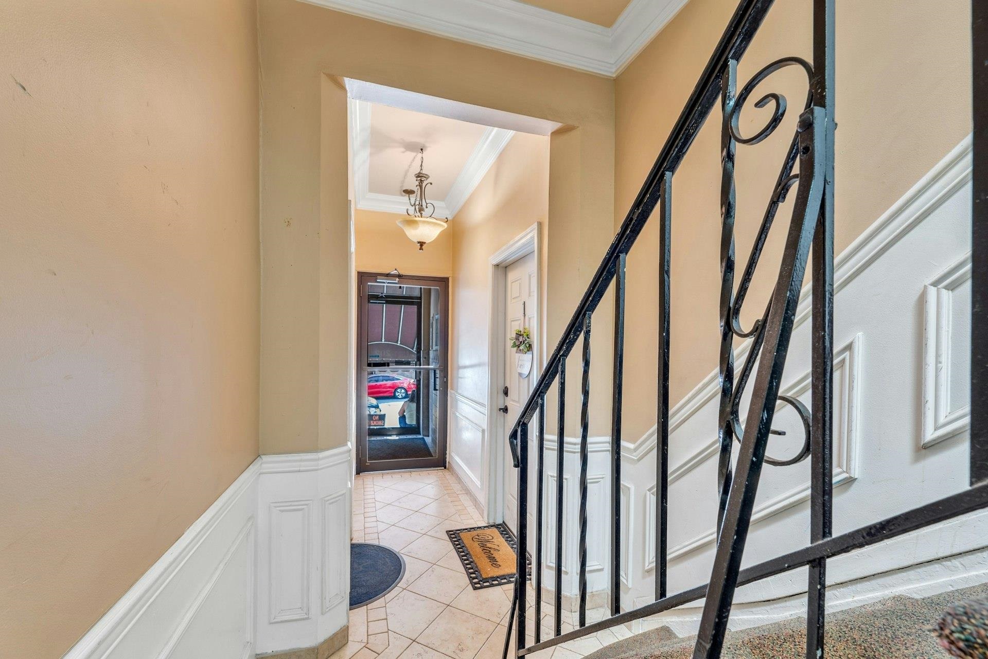 202 48th Street, Unit 3 Union City, NJ 07087 - Photo 16 of 17 a view of an entryway with wooden floor