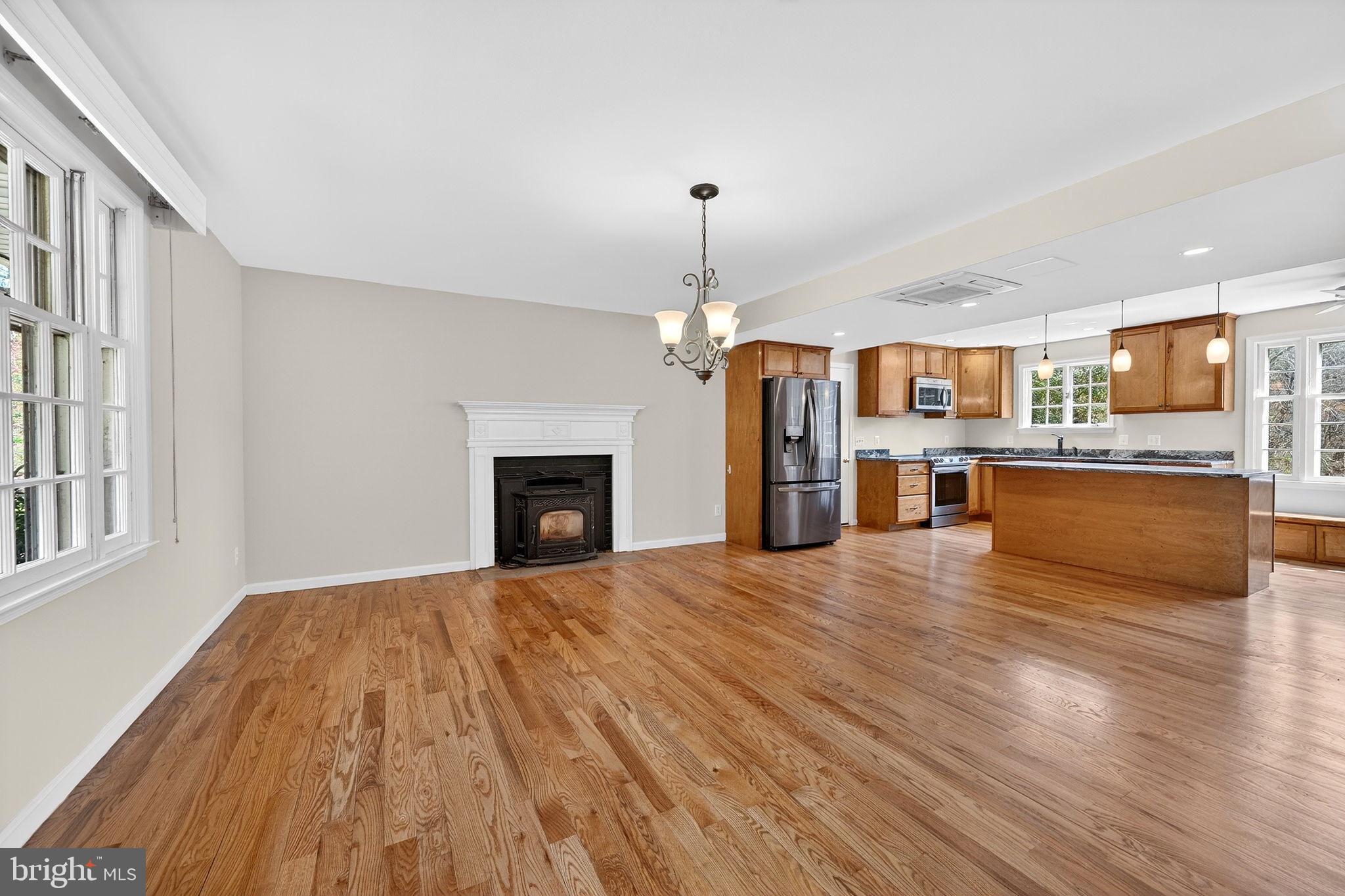 19635 Eagle Mill Road Parkton, MD 21120 - Photo 12 of 86 a view of a kitchen with a stove cabinets and wooden floor