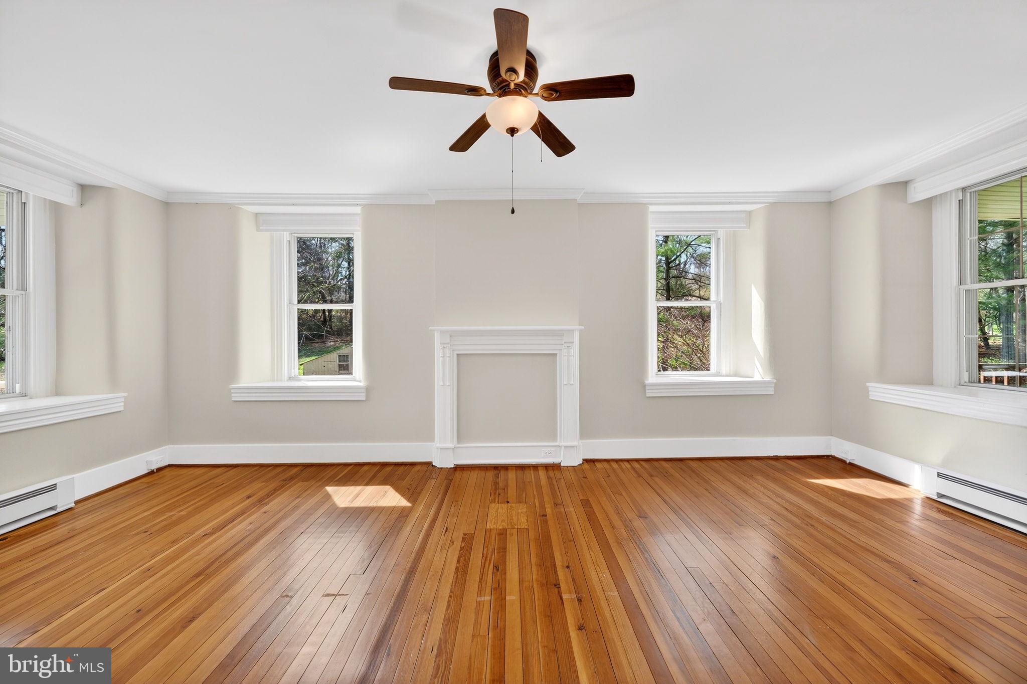 19635 Eagle Mill Road Parkton, MD 21120 - Photo 25 of 86 a view of an empty room with wooden floor and a window