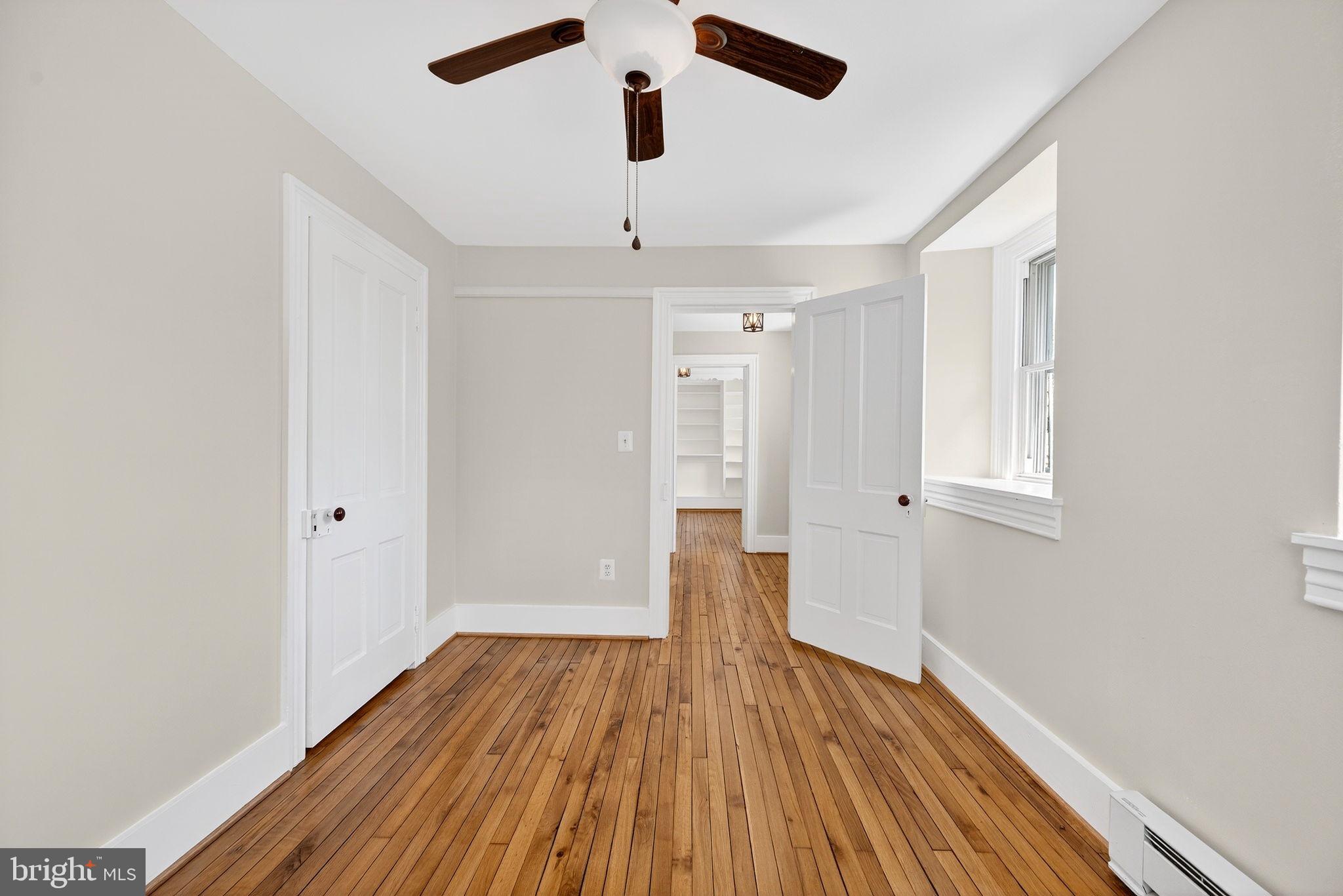 19635 Eagle Mill Road Parkton, MD 21120 - Photo 38 of 86 a view of a room with wooden floor and ceiling fan