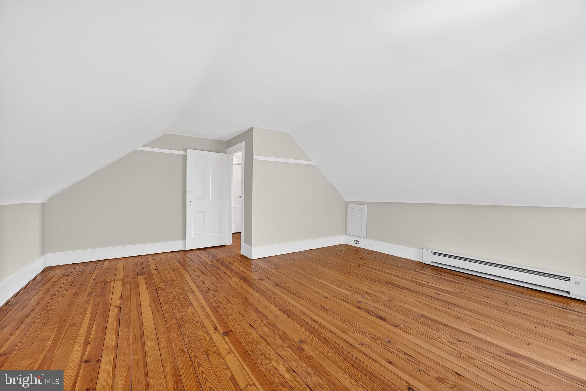 19635 Eagle Mill Road Parkton, MD 21120 - Photo 44 of 86 a view of an empty room with wooden floor and a window