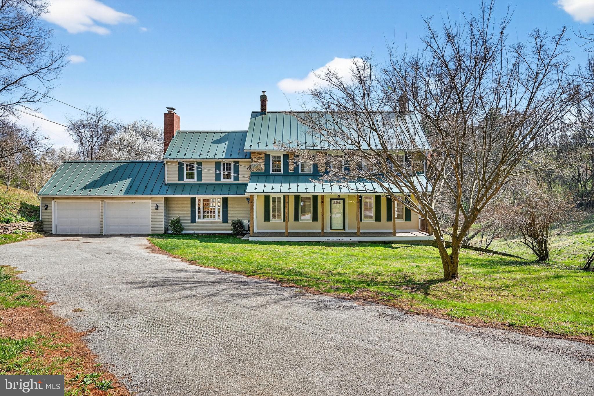 19635 Eagle Mill Road Parkton, MD 21120 - Photo 66 of 86 a view of a house with a yard and potted plants