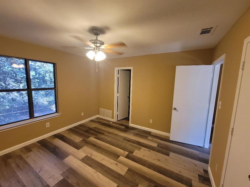 133 Lori Drive, Unit A & B Mineral Wells, TX 76067 - Photo 11 of 15 a view of room with window and ceiling fan