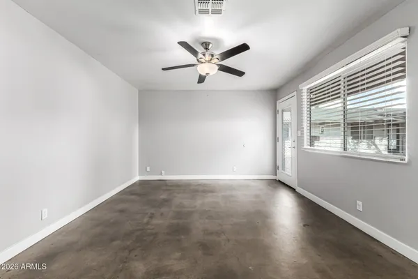 a view of an empty room with a window