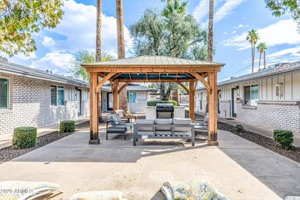 a view of house with outdoor seating