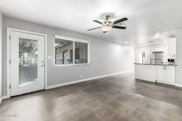 a view of an empty room with a window