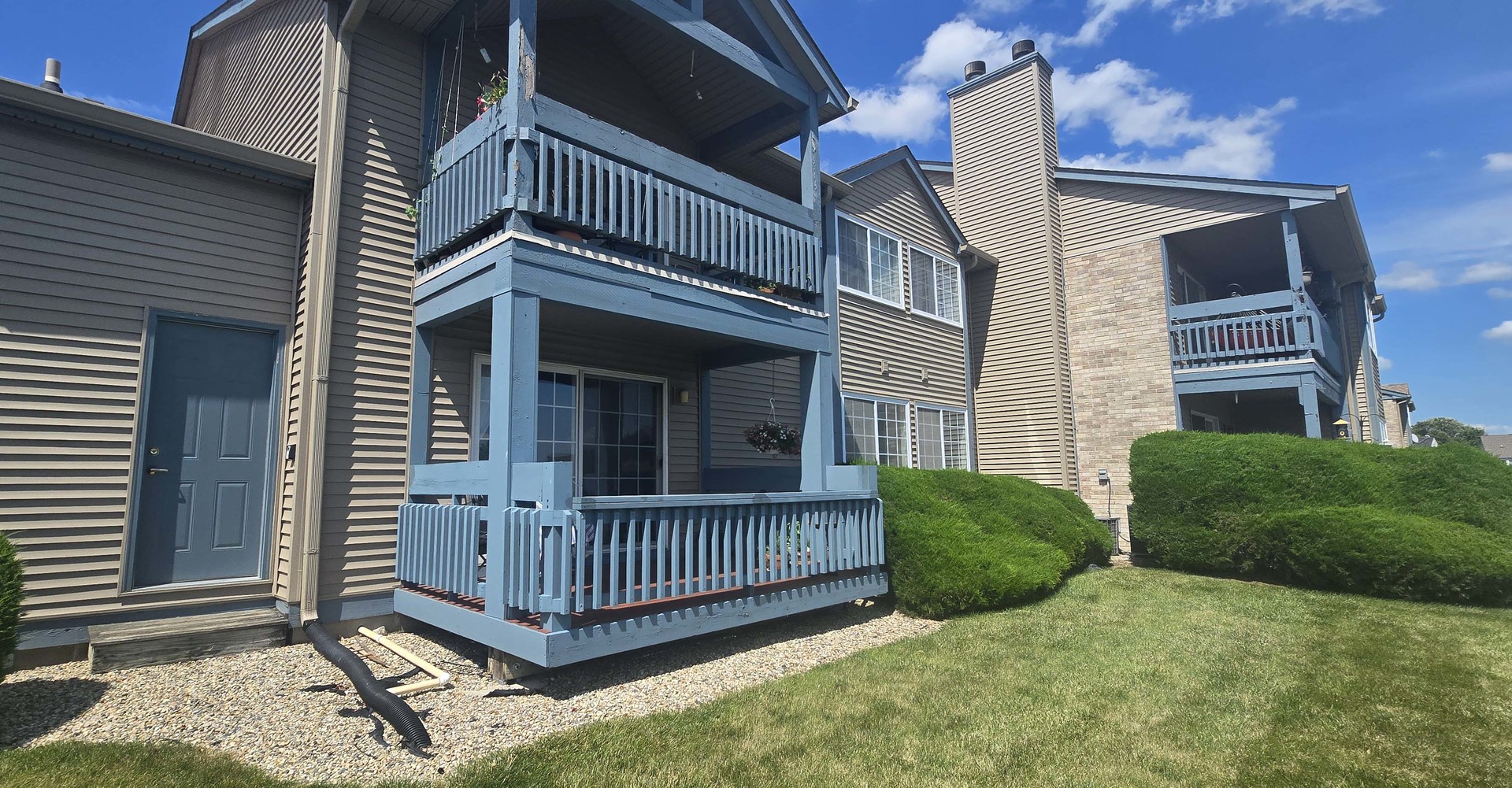 2408 Windward Boulevard, Unit 106 Champaign, IL 61821 - Photo 12 of 17 a view of a house with a roof deck
