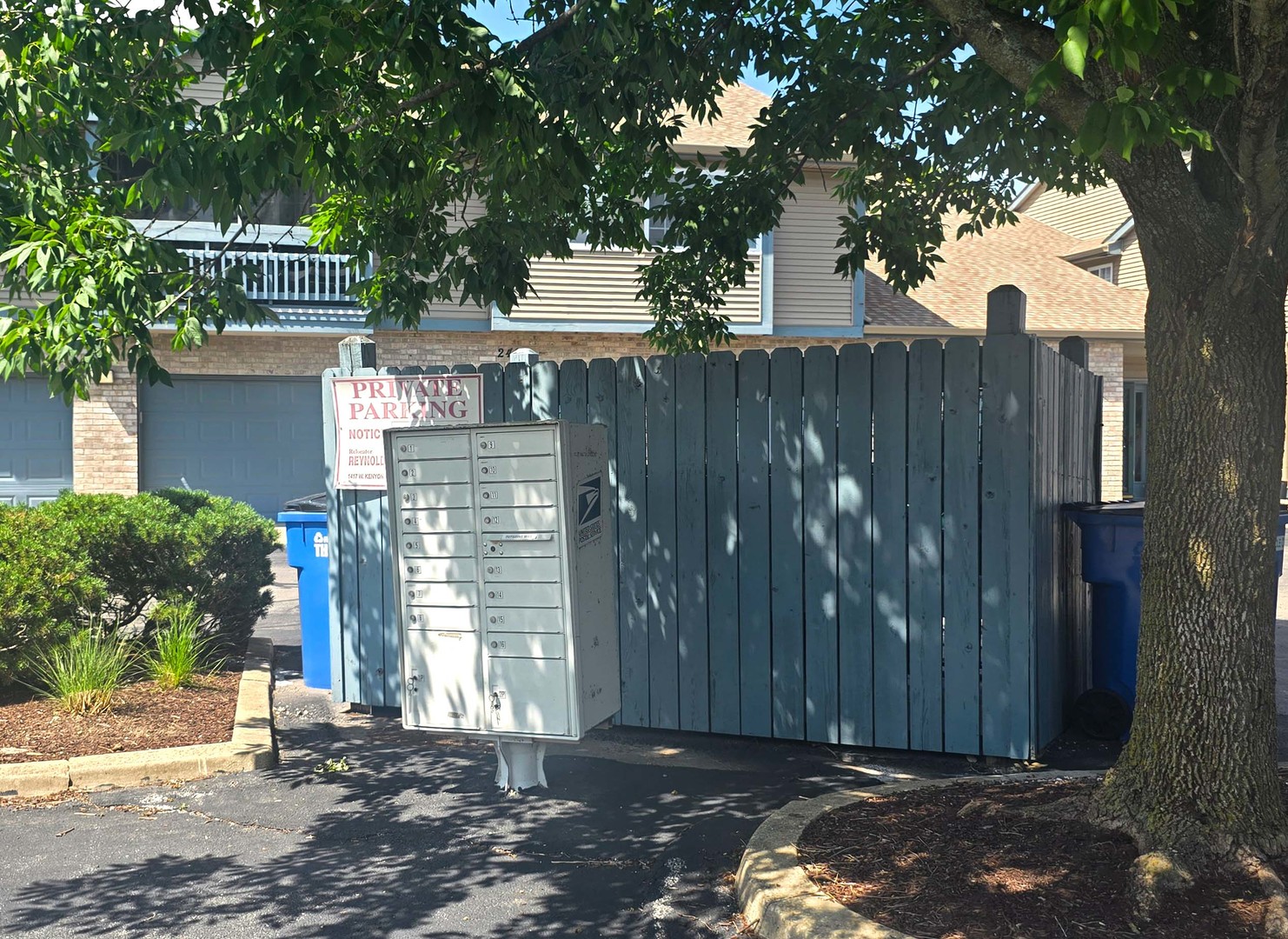 2408 Windward Boulevard, Unit 106 Champaign, IL 61821 - Photo 17 of 17 a view of a entrance gate of the house and trees