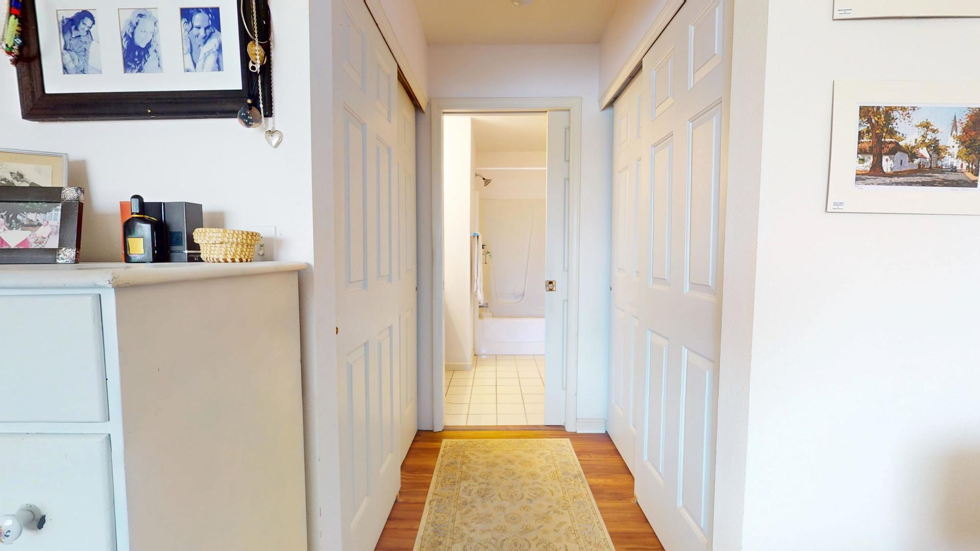 2408 Windward Boulevard, Unit 106 Champaign, IL 61821 - Photo 7 of 17 a view of a hallway with shelves
