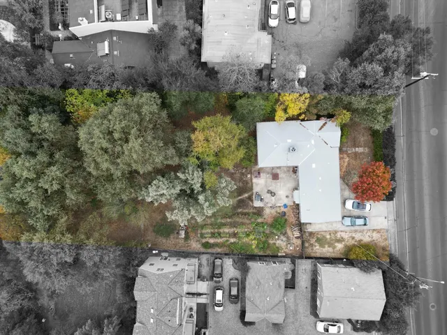 an aerial view of a house with outdoor space
