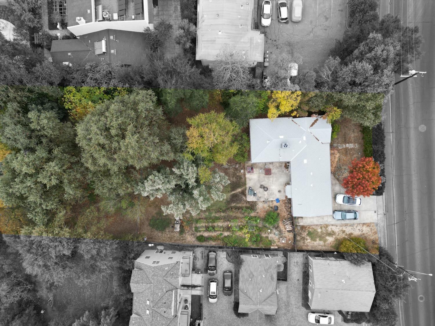 an aerial view of a house with outdoor space