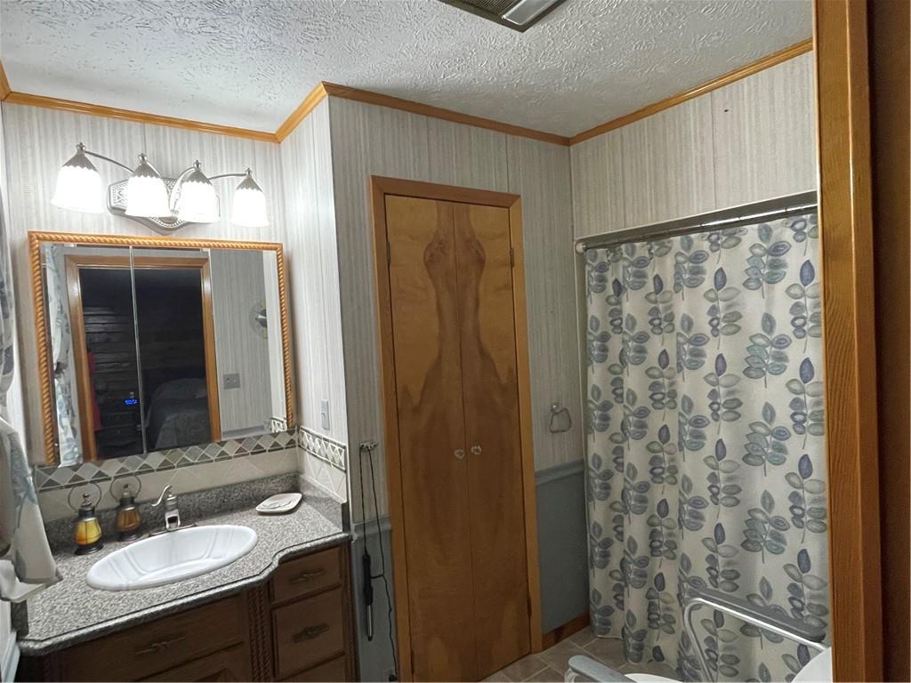 1844-1846 Cherry Tree Road Cherry Tree, PA 15724 - Photo 12 of 26 a bathroom with a granite countertop sink and a mirror