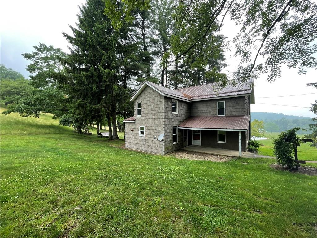 1844-1846 Cherry Tree Road Cherry Tree, PA 15724 - Photo 20 of 26 a view of a house with a yard porch and sitting area