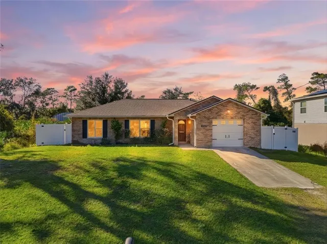 a front view of a house with yard