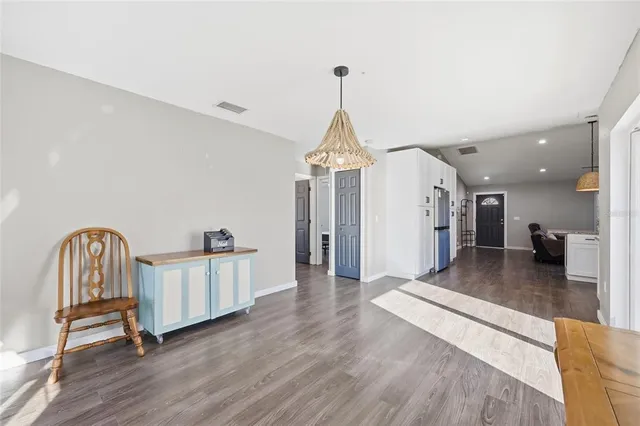 a view of a hallway with entryway wooden floor windows and entryway