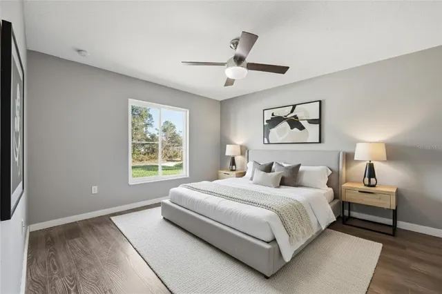 a bedroom with a large bed and a window