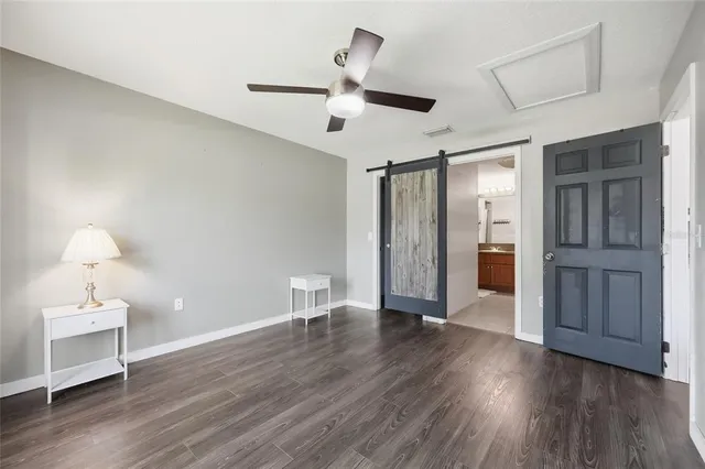 a view of an empty room and wooden floor