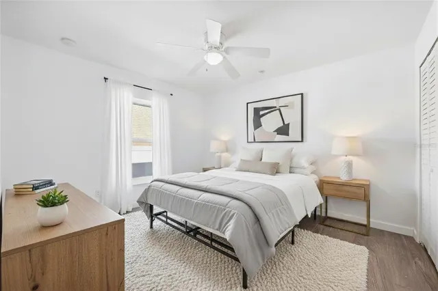 a bedroom with a bed and a window