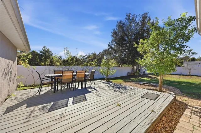 swimming pool view with a seating space