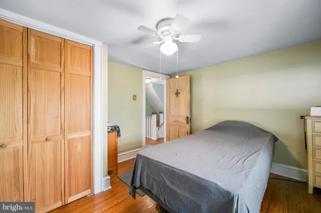 a spacious bedroom with a bed and a window
