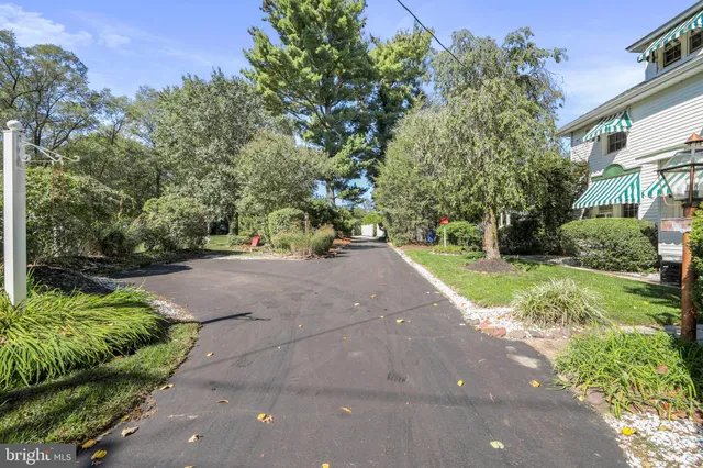 an aerial view of a house with yard