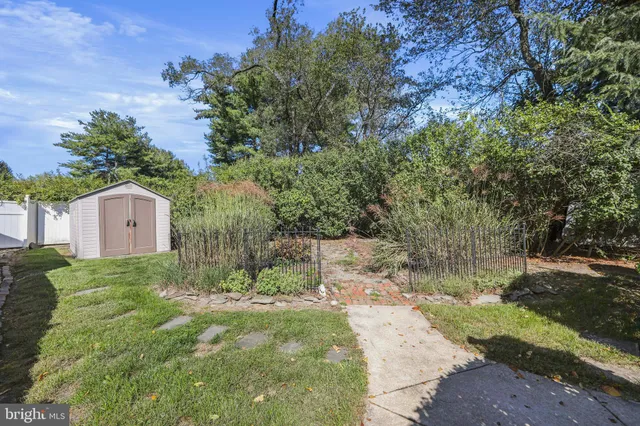 an aerial view of a house with a yard basket ball court and outdoor seating