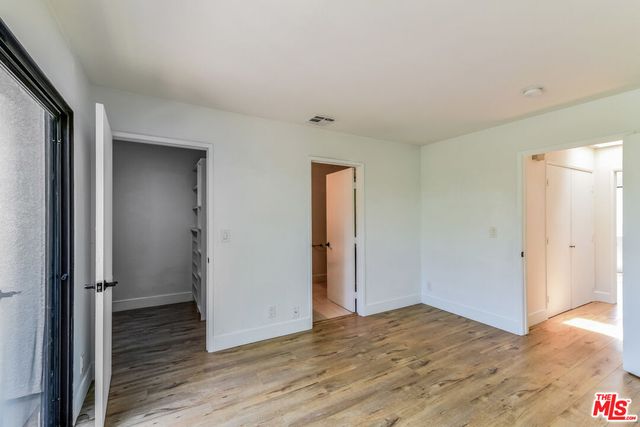 a view of a livingroom with wooden floor