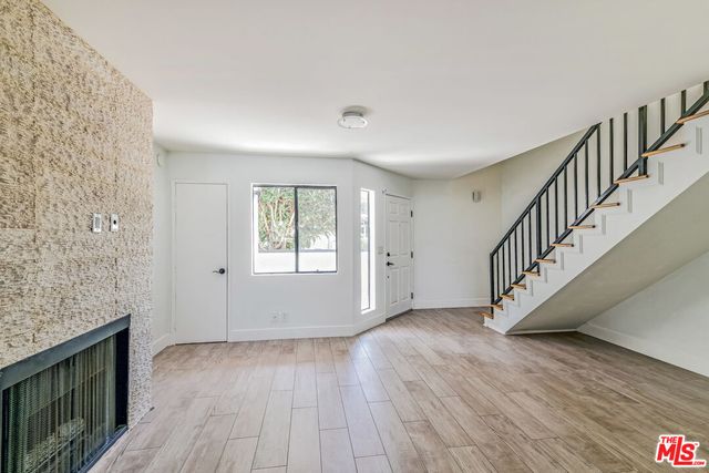a view of entryway with wooden floor