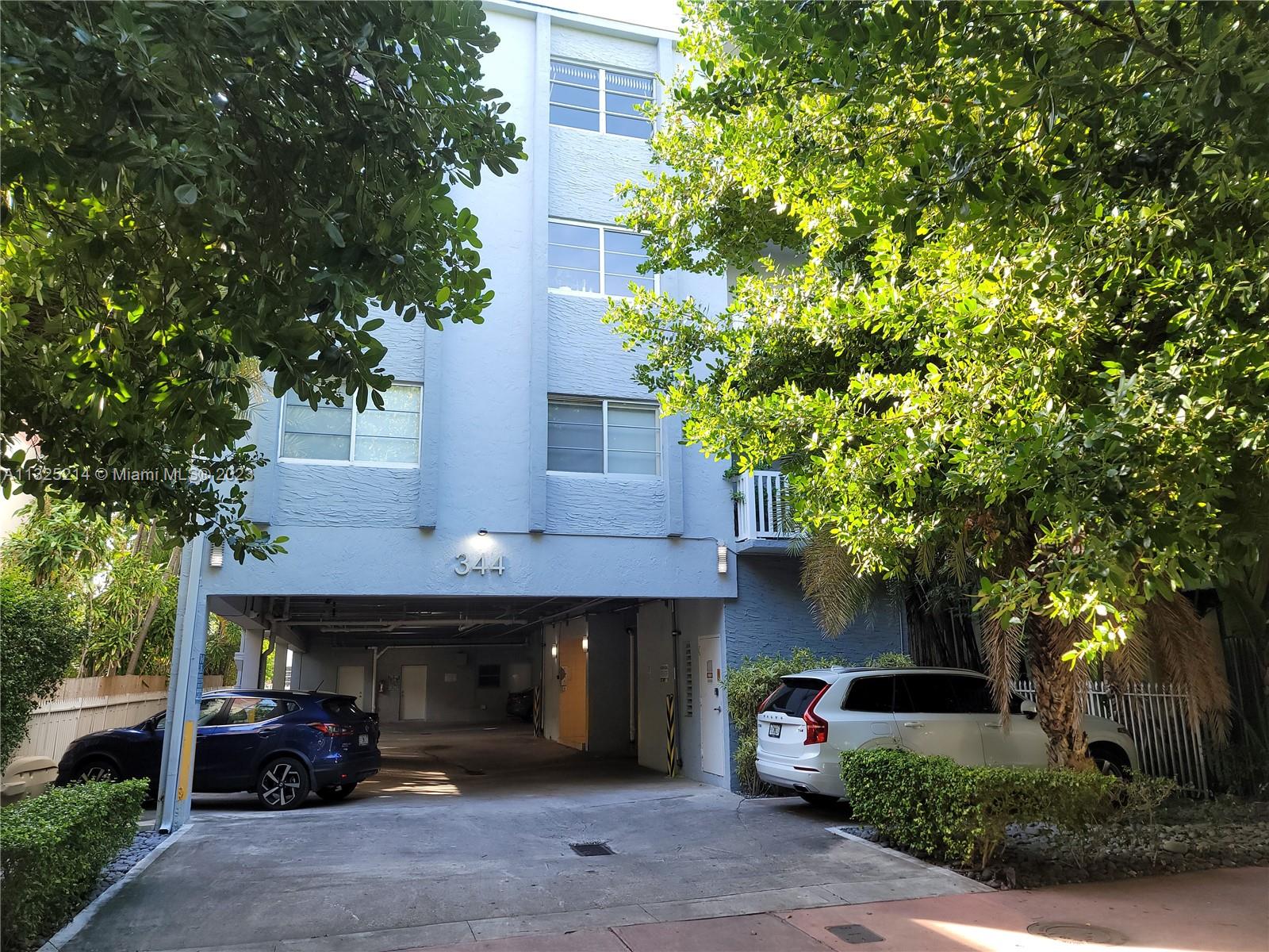 a front view of a house with car parked