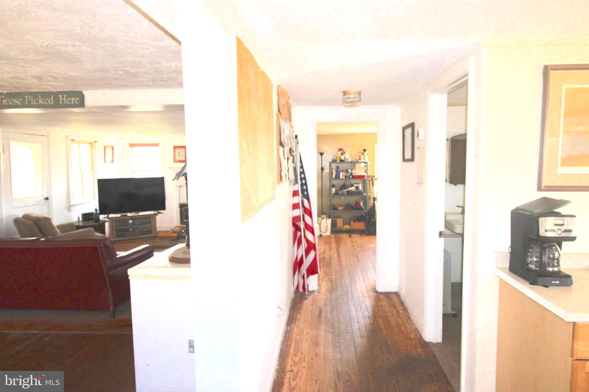 2352 Elliott Island Road Vienna, MD 21869 - Photo 13 of 21 a living room with furniture and a flat screen tv