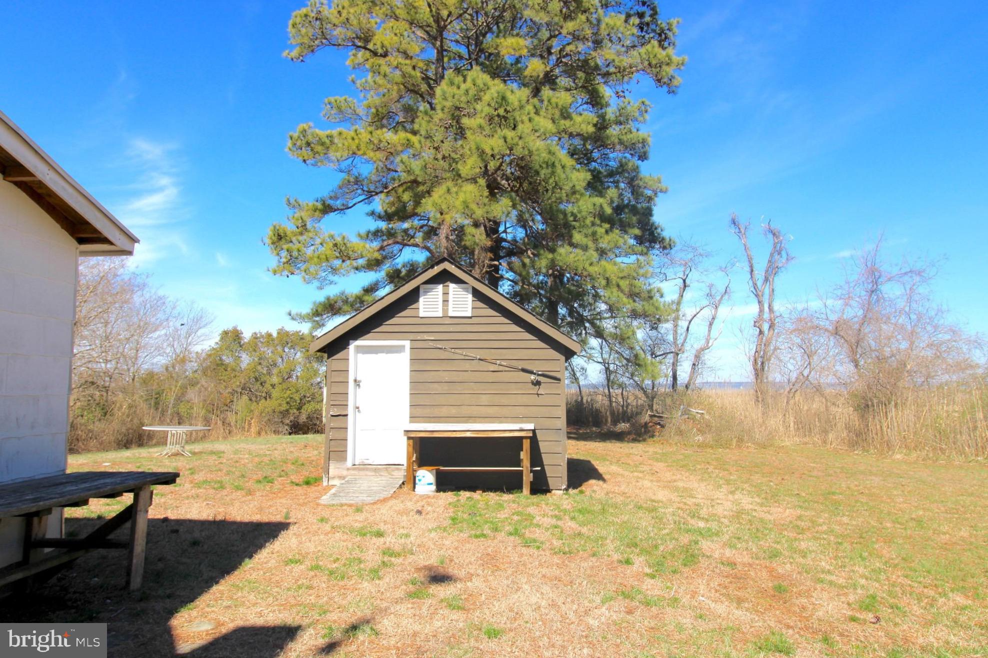 2352 Elliott Island Road Vienna, MD 21869 - Photo 7 of 21 a view of a house with a yard