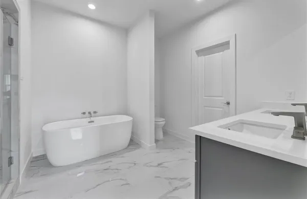 a bath room with a sink and a mirror