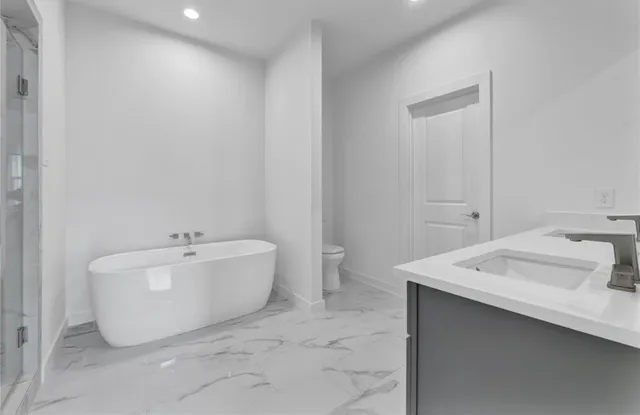 a bath room with a sink and a mirror