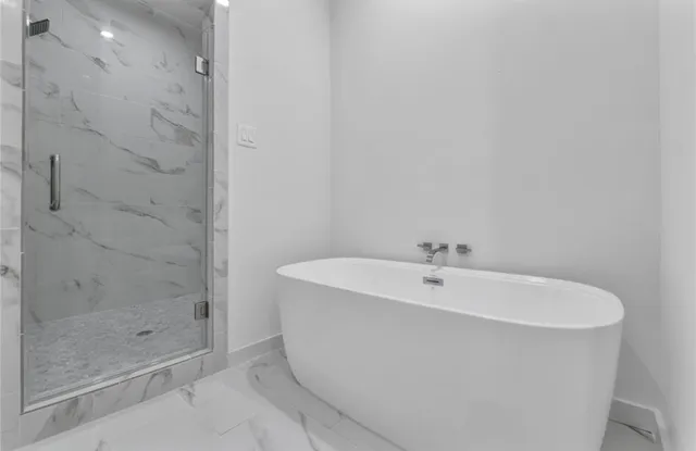 a white bath tub sitting in a bathroom