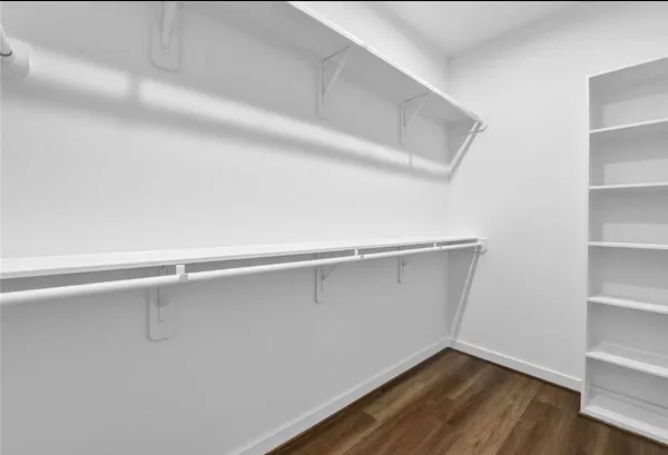 a view of an empty walk in closet