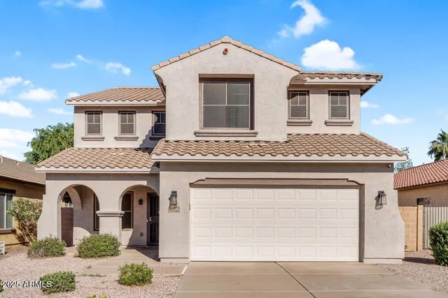 a front view of a house with a garage