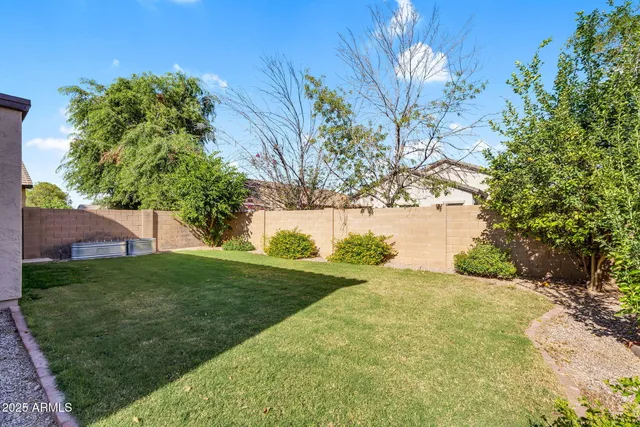 a view of a backyard of the house
