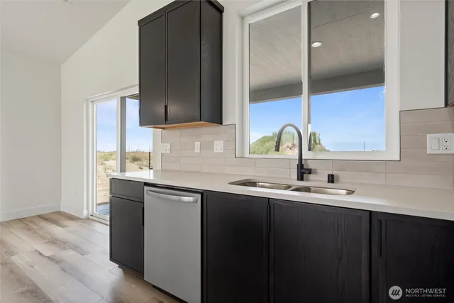 a kitchen with a sink and cabinets