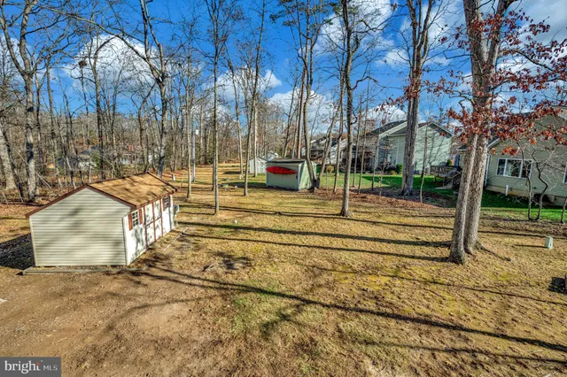 a view of a dining room with furniture and window