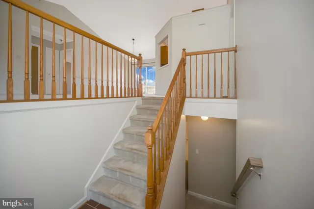 a kitchen with stainless steel appliances granite countertop a refrigerator a stove and a sink