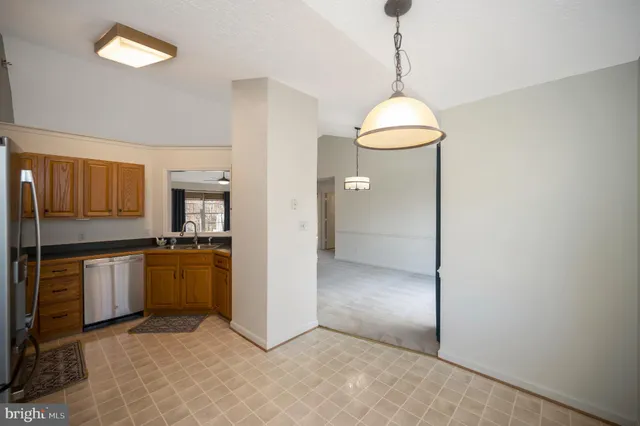 a view of an empty room with a fireplace
