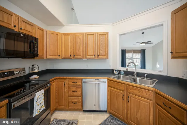 an empty room with a empty space and windows