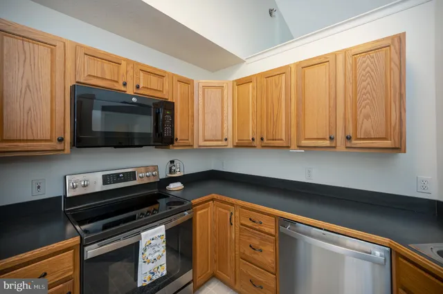 a view of a lake with houses in the background