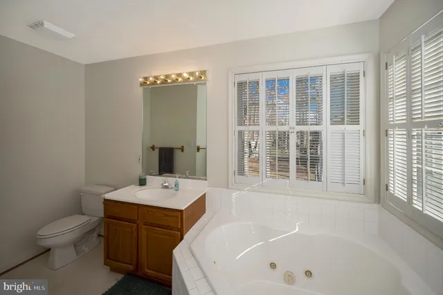 a view of a lake with outdoor seating space