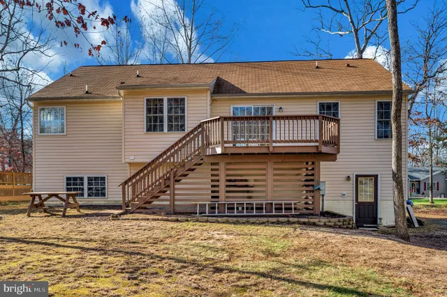 a living room with furniture or window and a wooden floor